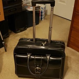 Leather rolling briefcase.